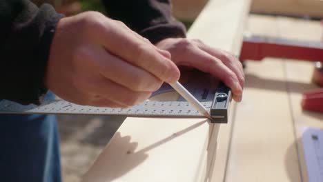 the stacked wood is marked with the pencil