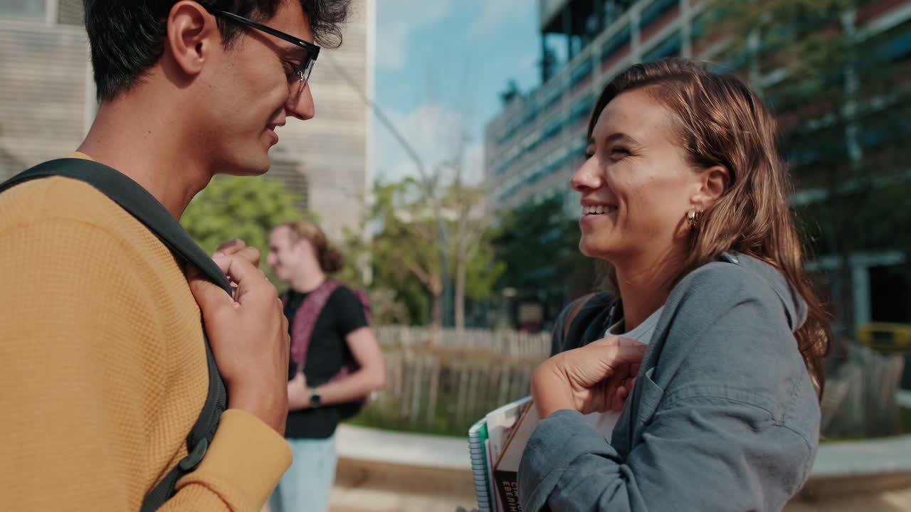 Close up of two friends, European male and female students in casual clothes