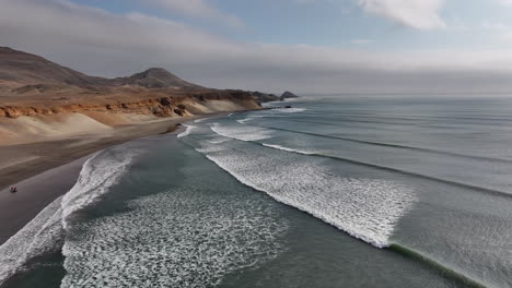 Low-Overview-Drone-Shote-Chicama-Waves-Puerto-Malabrigo-Peru-Famous-Waves-Surf-Spot