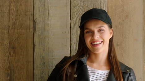 smiling woman in a black baseball cap