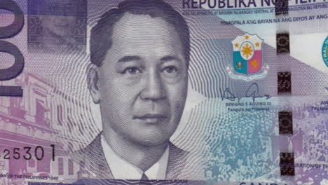 philippine 100-peso banknote details on green screen