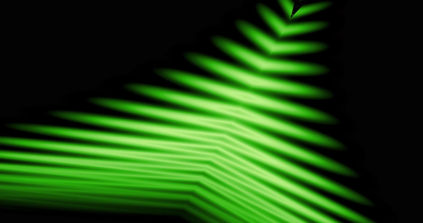 Motivi astratti di luce verde in movimento su sfondo nero