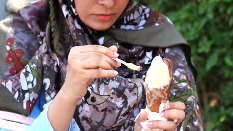 Young-women-eating-chocolate-flavor-ice-cream