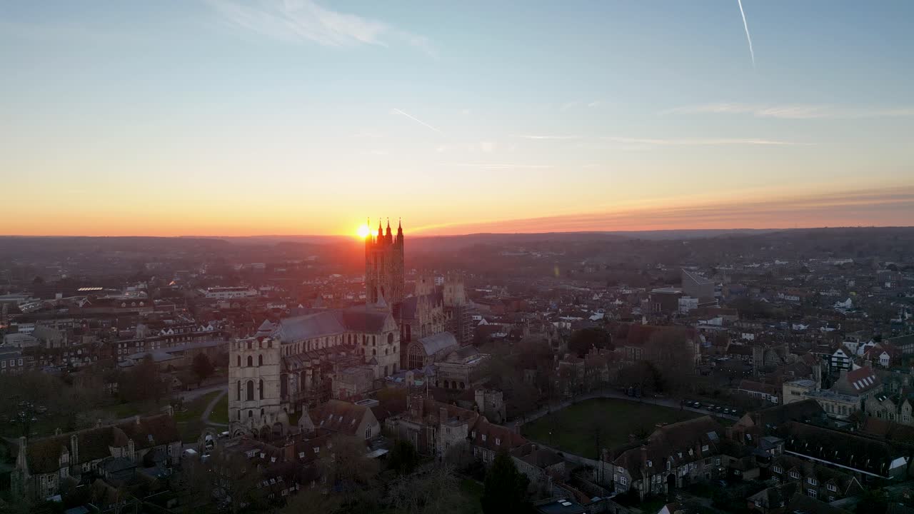 Canterbury Cathedral with the sun setting behind it