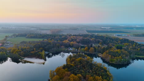 aerial view of dutch landscape. aerial view captures the serene beauty of dutch landscapes with lush greenery and reflective waters during twilight