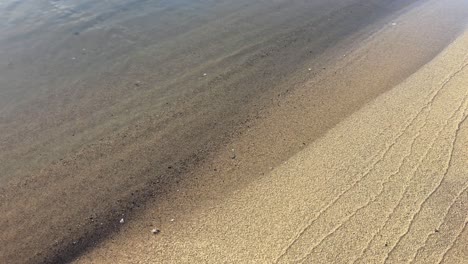 gentle waves on the sand beach