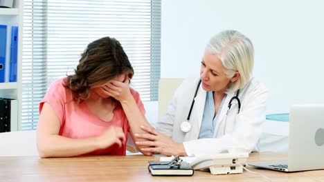 Female-doctor-consoling-a-patient