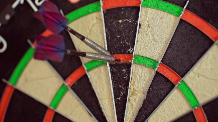A dart is thrown to complete a 180 score