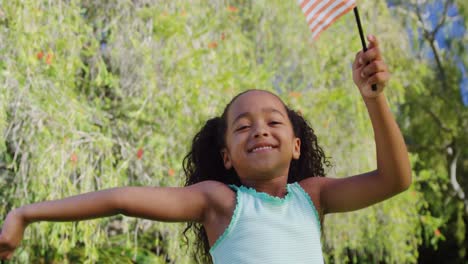 a child is playing with an american flag