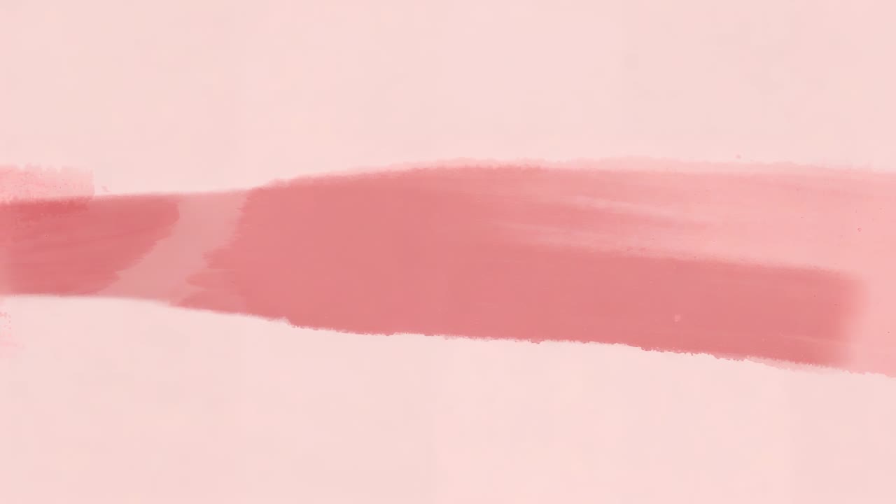 Brush tip entering left, laying diluted pink wash on textured sheet at studio, building two bands