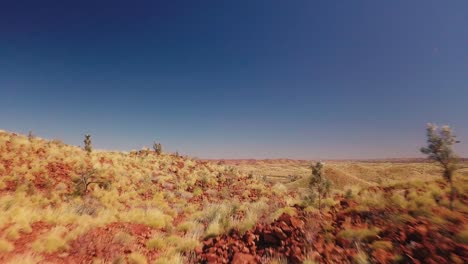 aerial drone flying low over vast australian desert mountain