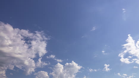 Sunny-Blue-Sky-With-Rolling-Cumulus-Clouds-In-Summer