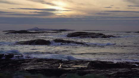 some heavy waves coming ashore during sunset