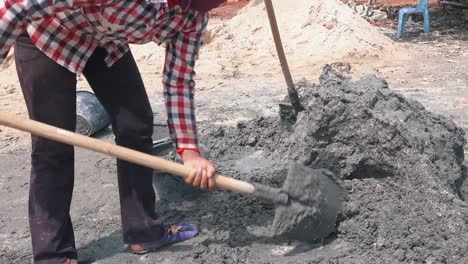 Worker-Mixing-Concrete-on-a-Sunny-Day