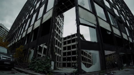 destroyed skyscraper in urban setting
