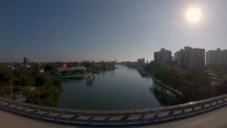 Aerial-4K-Drone-footage-of-up-and-over-Vanderbilt-Channel-Bridge-and-along-the-River