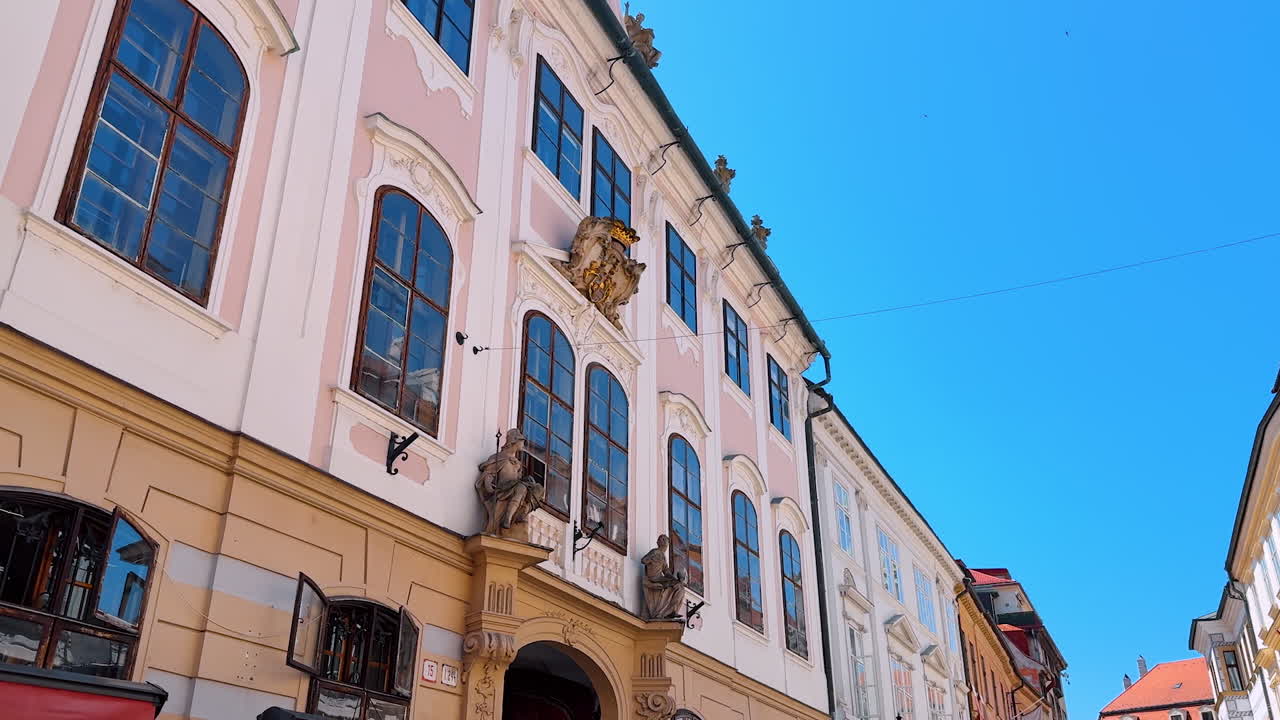 Bratislava, Slovakia, 2 June 2025: Beautiful three-storied buildings with stunning facades. Old-fashioned architecture in the old town of Bratislava, Slovakia