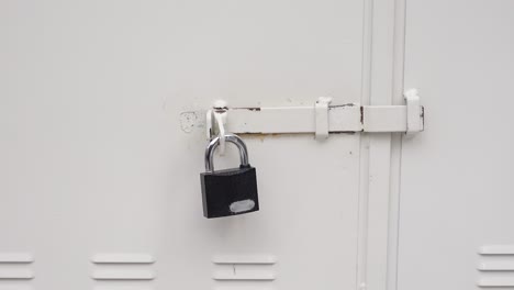 white metal door with padlock