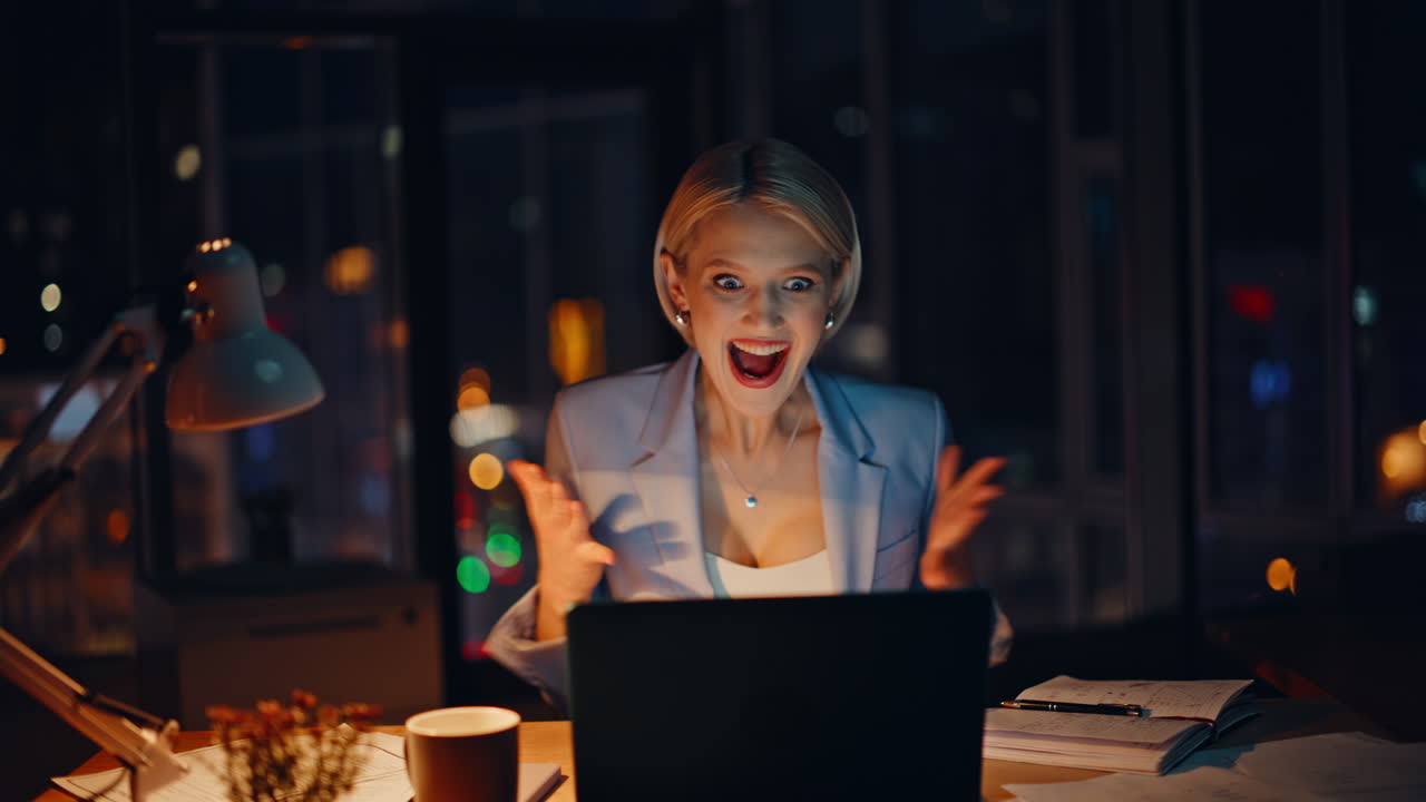 Blonde lawyer working late writing notes night office closeup. Manager rejoicing