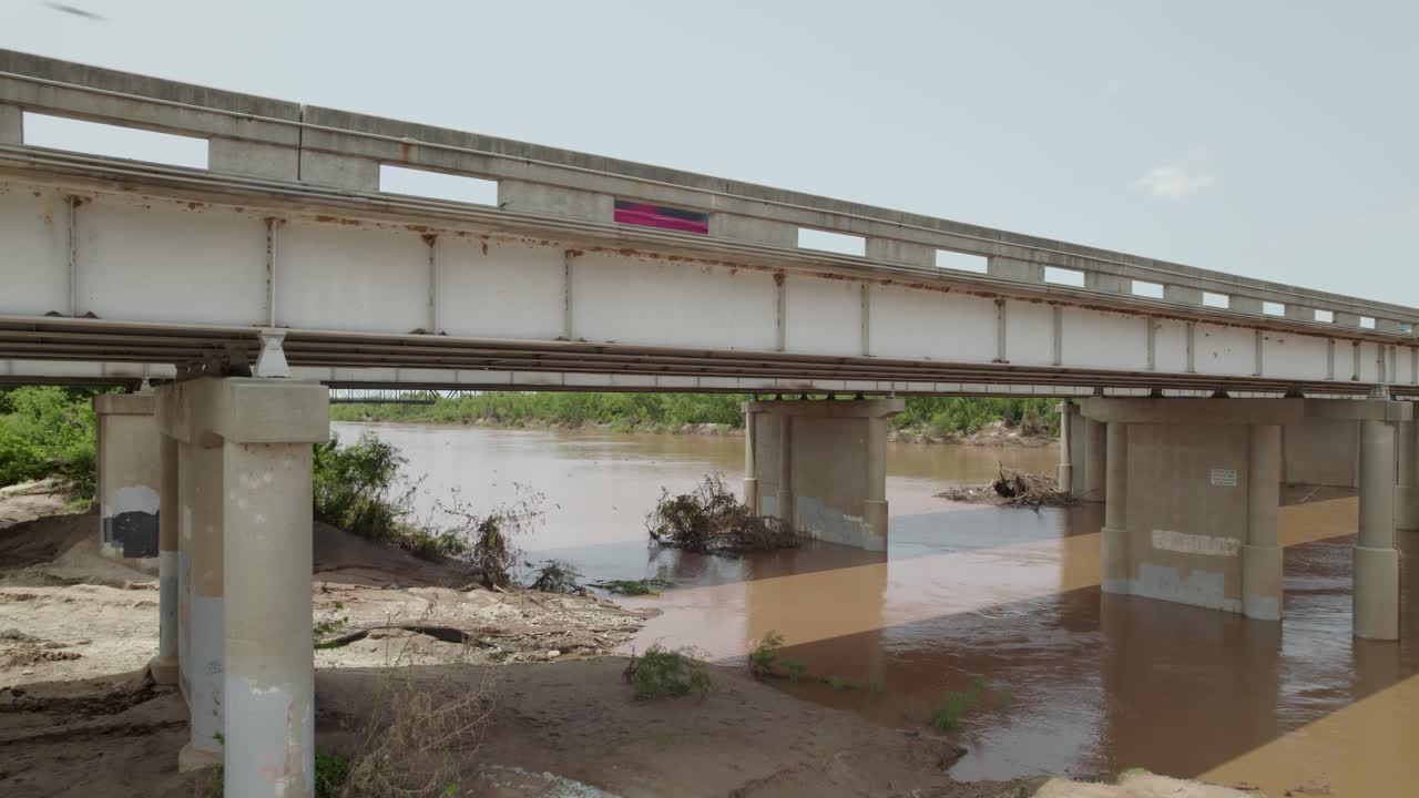 This is a static aerial video of Cave Swallow birds on the highway 35 bridge at the Red River in Gainesville