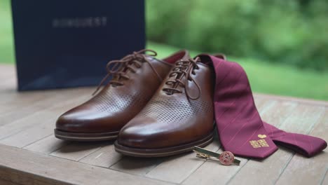 close-up-shots-of-the-groom's-wedding-attire,-focusing-on-shoes-and-meticulously-tied-ties