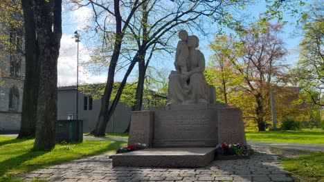 shot of the "in memory of the victims of the struggle for freedom 1948" statue in the domkirkegården (cathedral cemetery) near nidaros cathedral in trondheim, norway