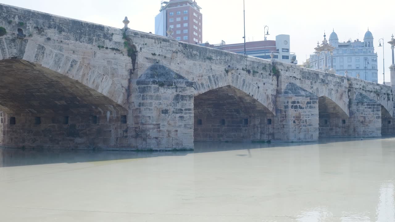 Ancient Stone Bridge over River in Spanish City