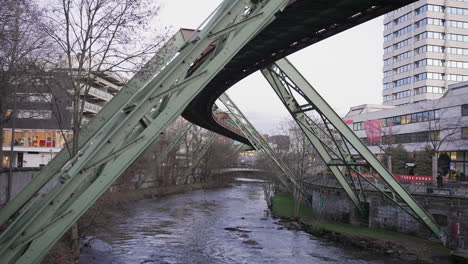 Wide-view-of-Wuppertal-suspended-railway-during-winter-dusk-in-Germany