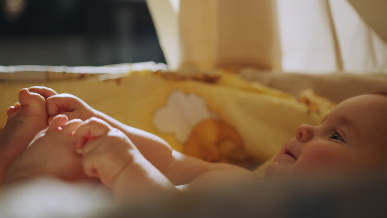 Happy Baby in a Crib