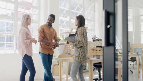 Busy-diverse-business-people-discussing-work-with-laptop-in-office-in-slow-motion