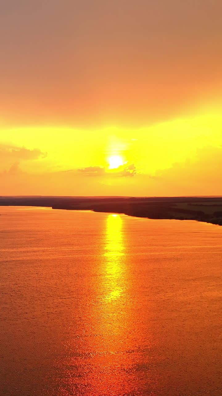 Scenic rural landscape. Aerial view of rural landscape against sunset Vertical video