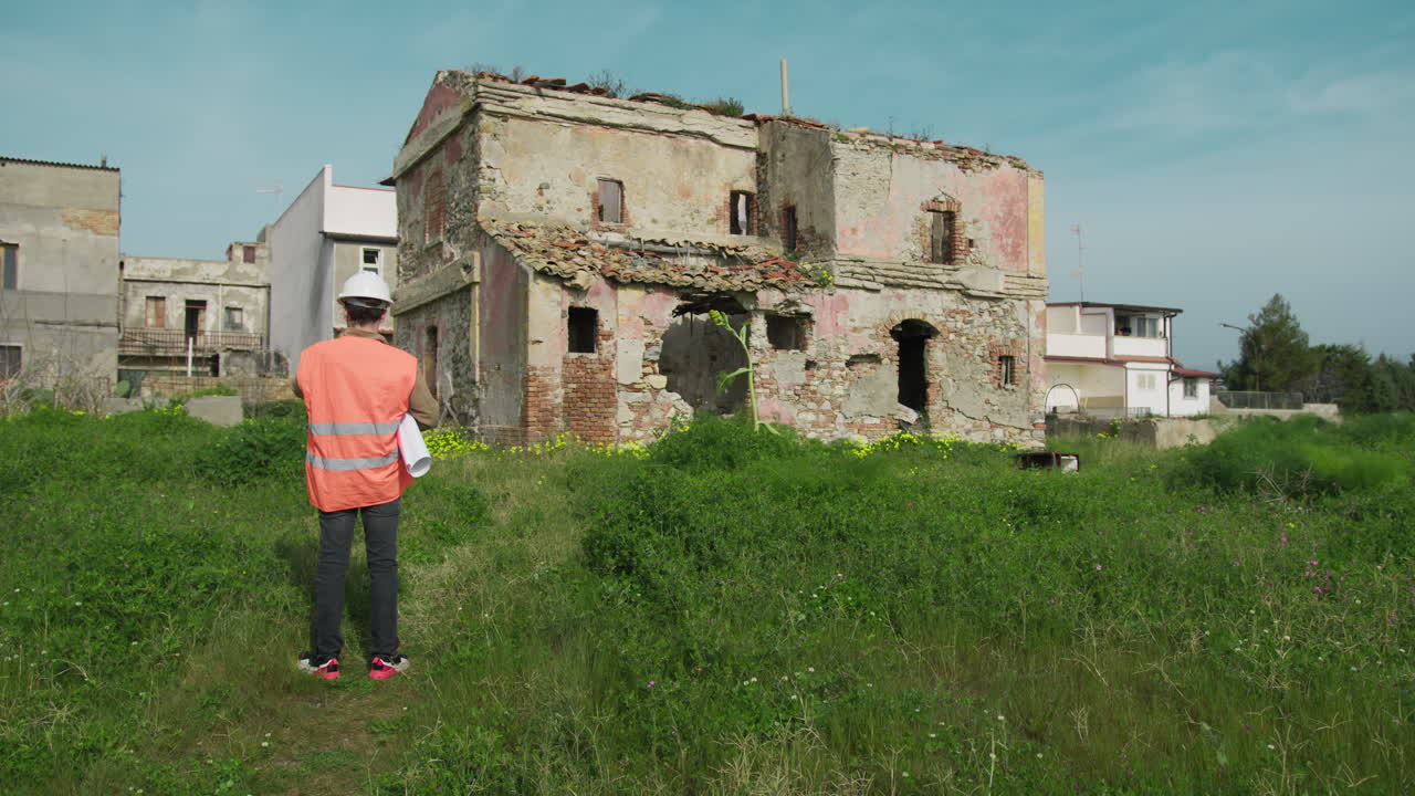 Engineer In The Nature Looking At The Building For Renewal Project