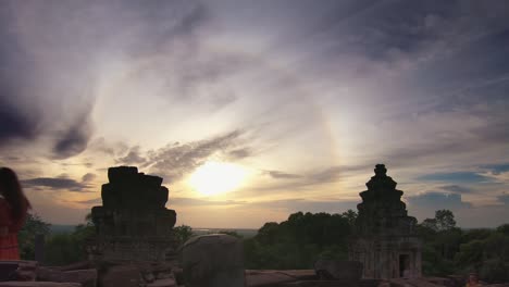 timelapse of sunset over asian temple rising out of the jungle