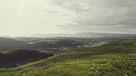 beautiful aerial flying over irish highlands during sunset