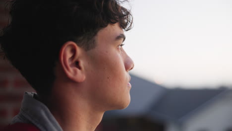 portrait of a thoughtful teenager looking off into the distance