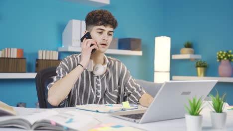 The-student-talking-on-the-phone-while-studying-at-home-is-angry.