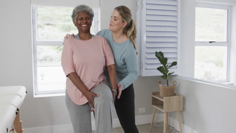 Caucasian-nurse-with-senior-woman-exercising,-copy-space,-slow-motion