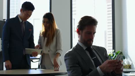 businessman using mobile phone in office 4k