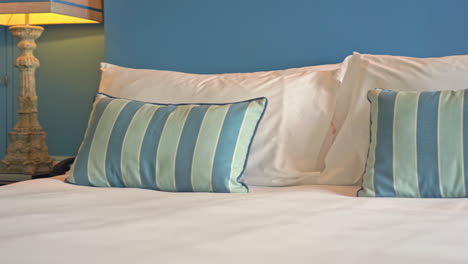 pan of decorative billow pillows placed on a resort hotel bed