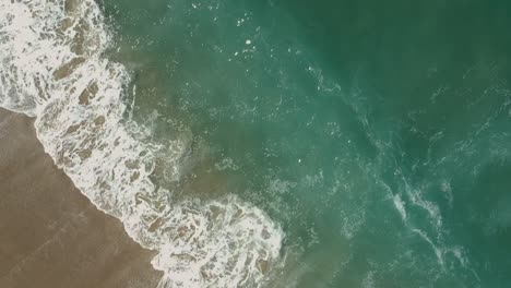 Afternoon-camera-drone-view-from-the-waterside-and-deeply-waves-of-Redondo-Beach,-California