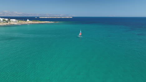 Kite-surfers-riding-in-the-wind-off-the-coast-of-Paros-in-Greece