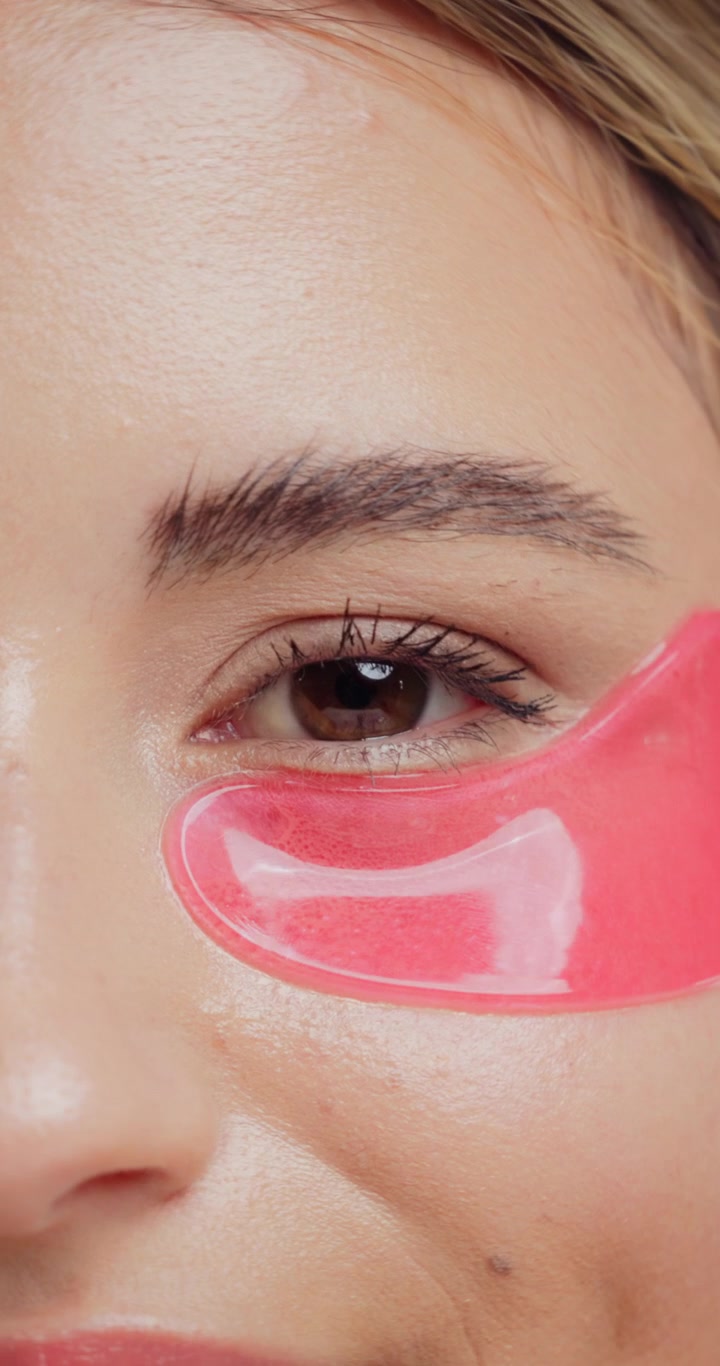 Close-up of Young Woman Wearing Pink Under-Eye Patches