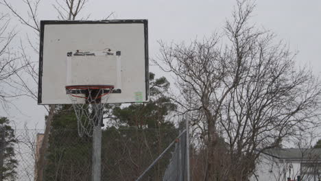 wide view of basketball hoop in urban street basketball field court, sweden