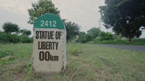 highway milestone showing distance of statue of liberty