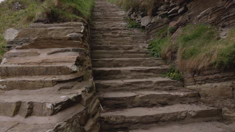 tilting shot revealing the well maintained stone stairs at the whaligoe steps