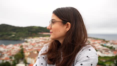 Female-tourist-smiles-while-enjoying-view-on-Angra-do-Heroismo