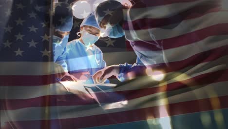 animation of flag of usa waving over surgeons in operating theatre