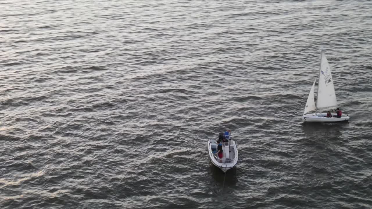 People At Watercraft Sailing At Lake Pontchartrain During Sunset In New Orleans, USA