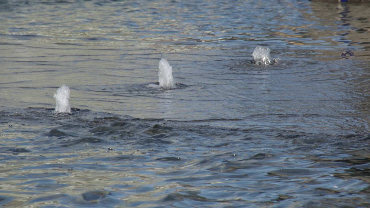 Close shop shot of a 3 bubble water fountain feature at Nupen fontenen at Nupen parken, Kristiansand