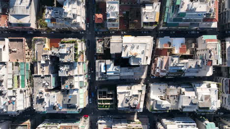 flying over apartment buildings in a densely populated city